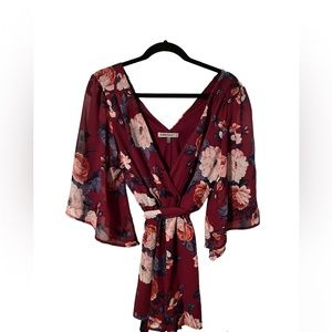 Size Small One piece jumper in chiffon with floral design and butterfly sleeves